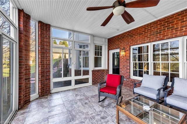 sunroom with a ceiling fan