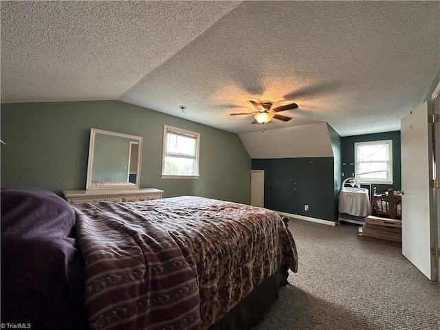 bedroom with ceiling fan, lofted ceiling, carpet, and multiple windows