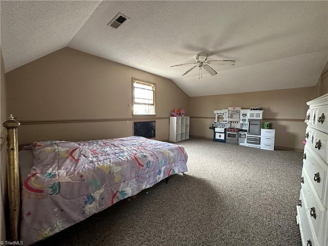 bedroom featuring ceiling fan, lofted ceiling, carpet flooring, and a textured ceiling