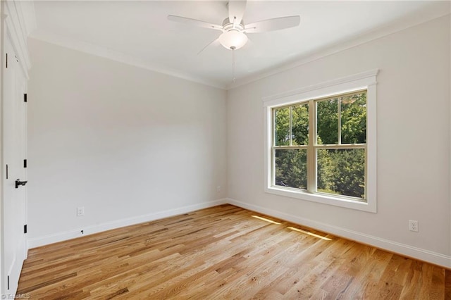 spare room with ceiling fan, ornamental molding, and light hardwood / wood-style floors