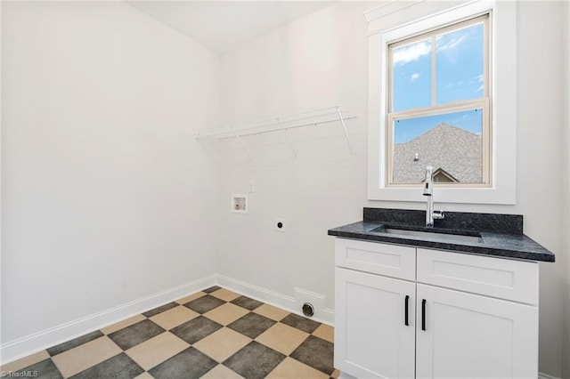 laundry area with hookup for a washing machine, electric dryer hookup, and sink