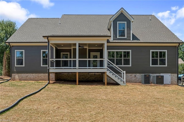 back of house with ceiling fan, a lawn, and central air condition unit