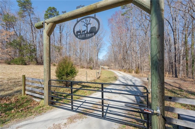 view of gate featuring fence