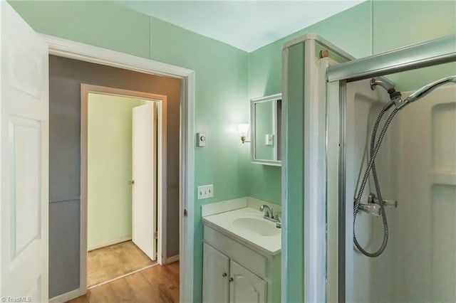 bathroom featuring vanity and wood finished floors