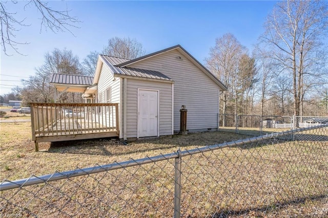 view of outbuilding with fence