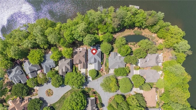 birds eye view of property with a water view and a residential view