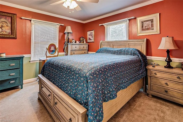 bedroom with crown molding, light colored carpet, and ceiling fan