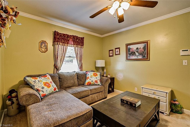 living room with ornamental molding, light colored carpet, and ceiling fan