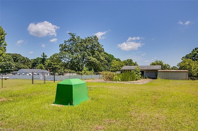 view of outbuilding featuring a yard