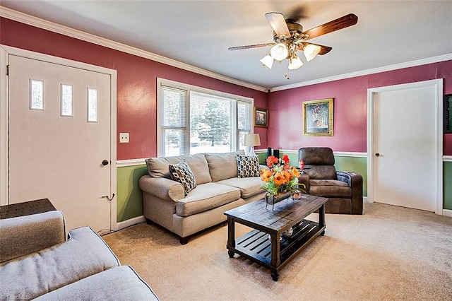 living room featuring crown molding, light colored carpet, and ceiling fan