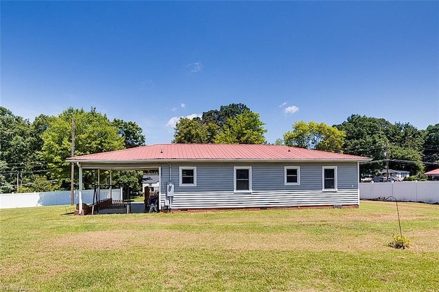 rear view of property with a yard