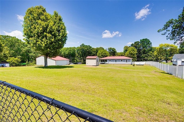 view of yard featuring a storage unit