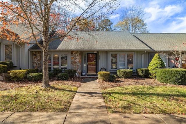 ranch-style house with a front lawn