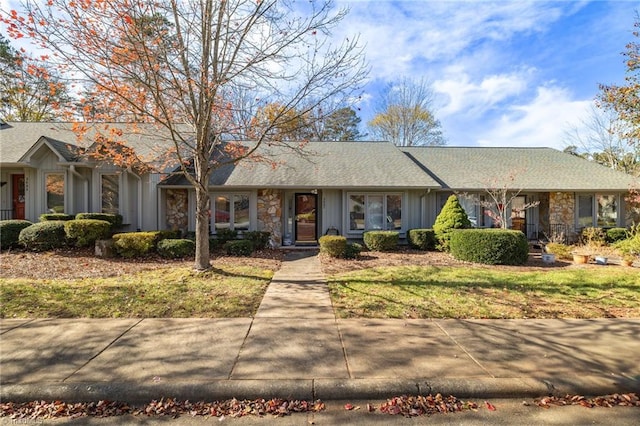 ranch-style home with a front lawn