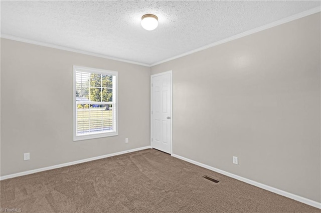 carpeted empty room featuring a textured ceiling and ornamental molding