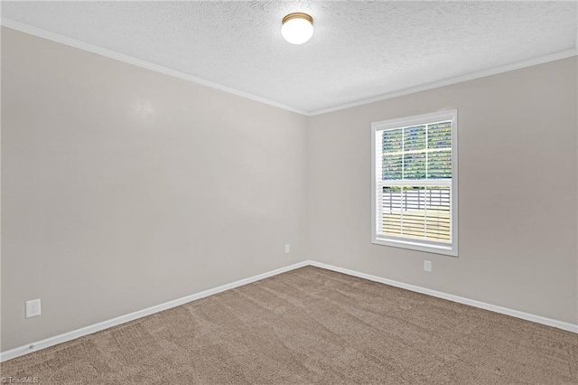 unfurnished room with carpet floors, a textured ceiling, and crown molding