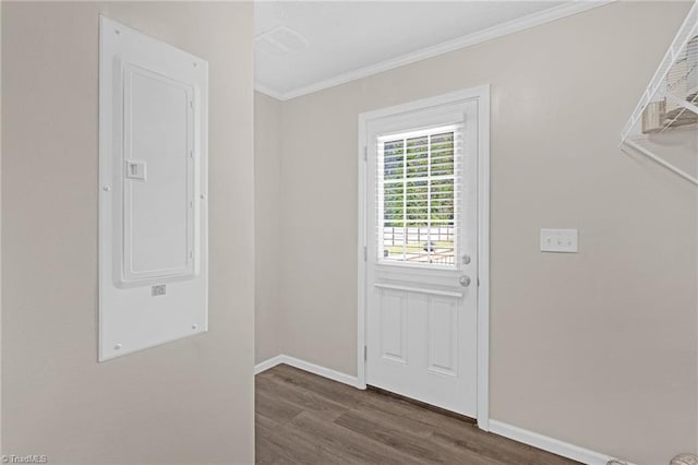 doorway to outside featuring electric panel, dark hardwood / wood-style flooring, and ornamental molding