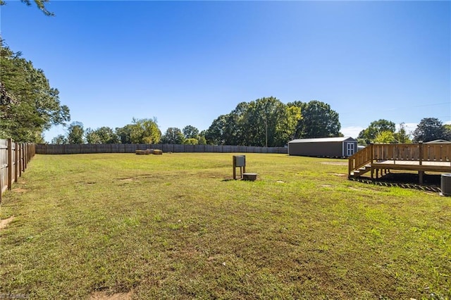 view of yard with a wooden deck