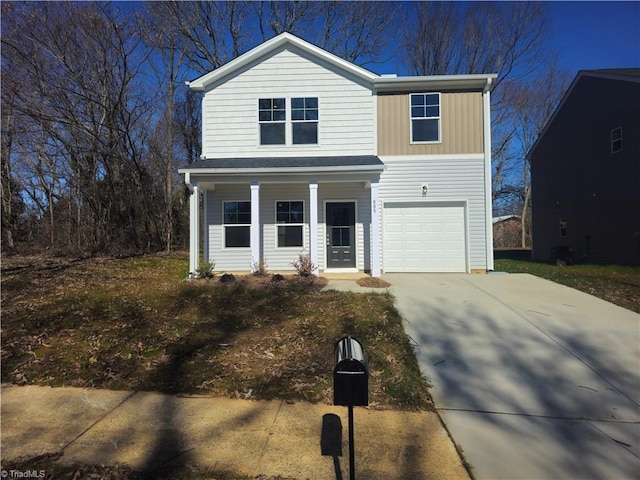 view of property featuring a porch and a garage