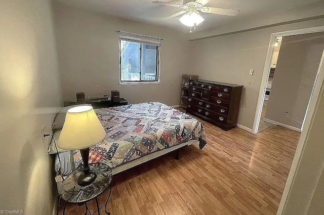 bedroom with ceiling fan and light hardwood / wood-style flooring