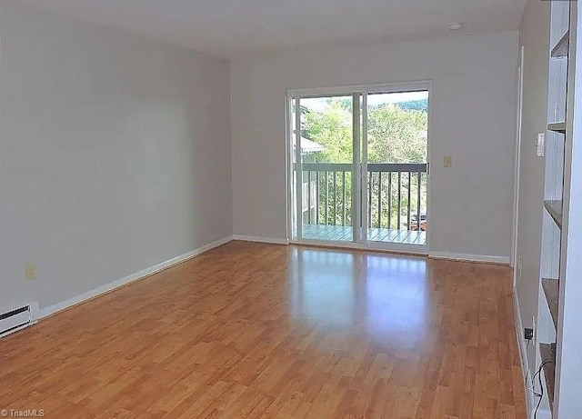 spare room featuring light hardwood / wood-style flooring