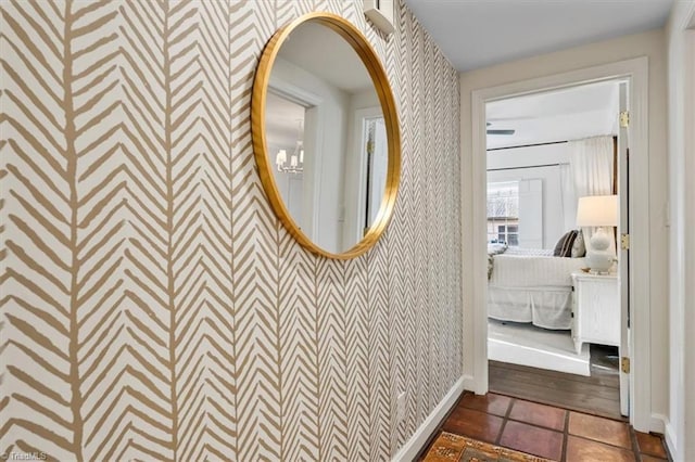 bathroom featuring tile patterned floors and a notable chandelier