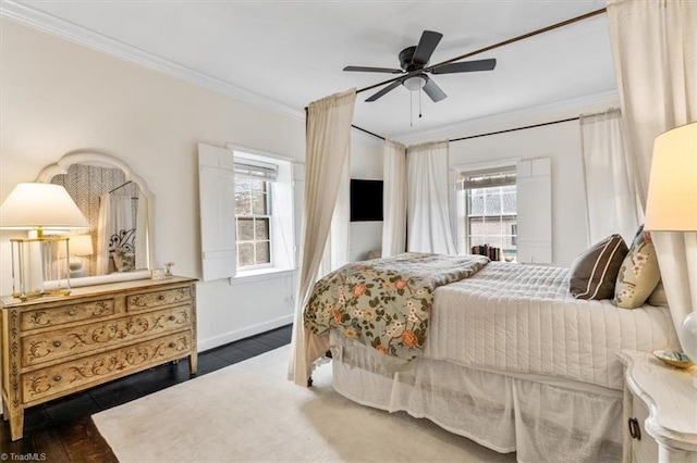 bedroom featuring dark hardwood / wood-style flooring, ornamental molding, and ceiling fan