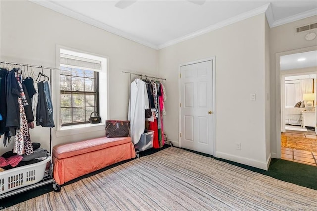 interior space with crown molding and carpet