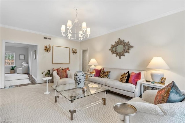 living room featuring ornamental molding and a notable chandelier