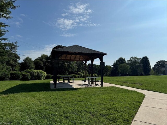 surrounding community featuring a gazebo and a yard