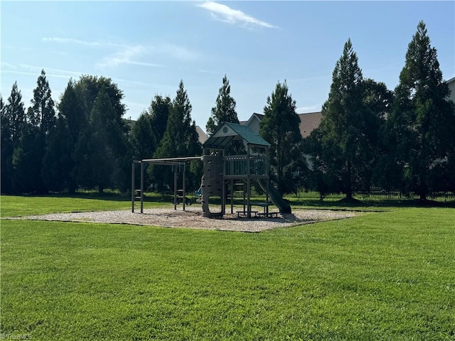 view of jungle gym featuring a lawn