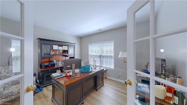 home office with light wood-type flooring