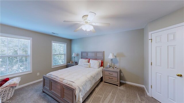 bedroom with ceiling fan and carpet flooring