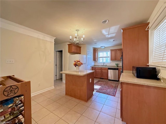 kitchen with white fridge, dishwasher, light tile patterned floors, a kitchen island, and sink