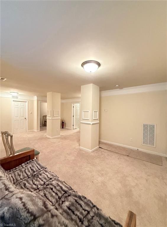 living room featuring light carpet and ornamental molding