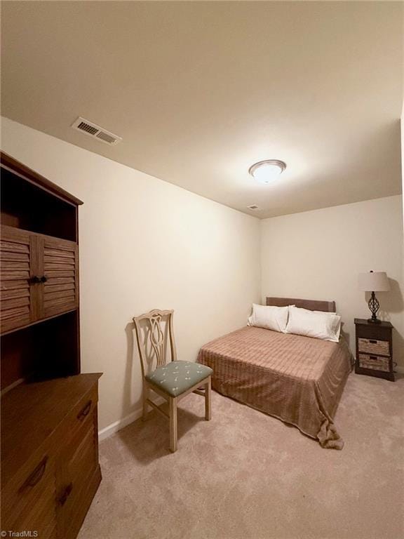 bedroom with light carpet