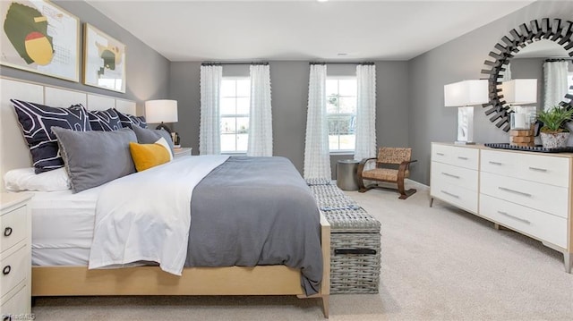 bedroom featuring light carpet