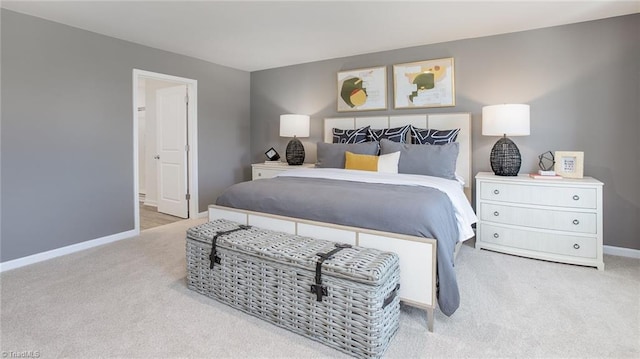 carpeted bedroom with baseboards