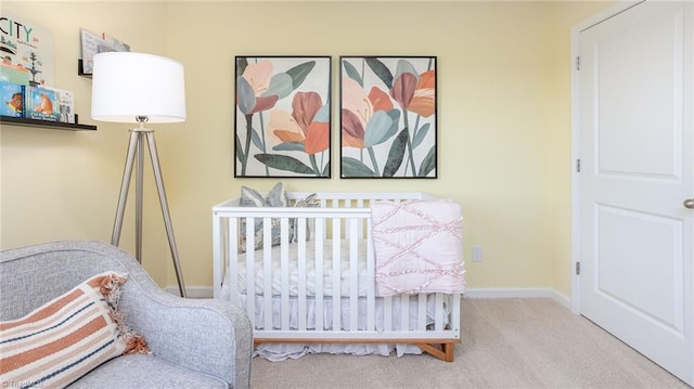 bedroom featuring carpet floors and baseboards