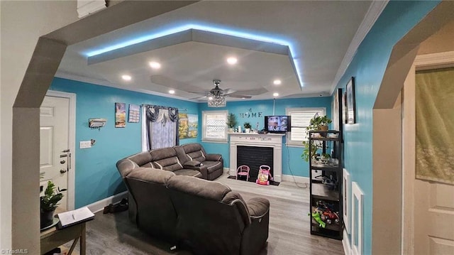 living room featuring hardwood / wood-style flooring and ceiling fan