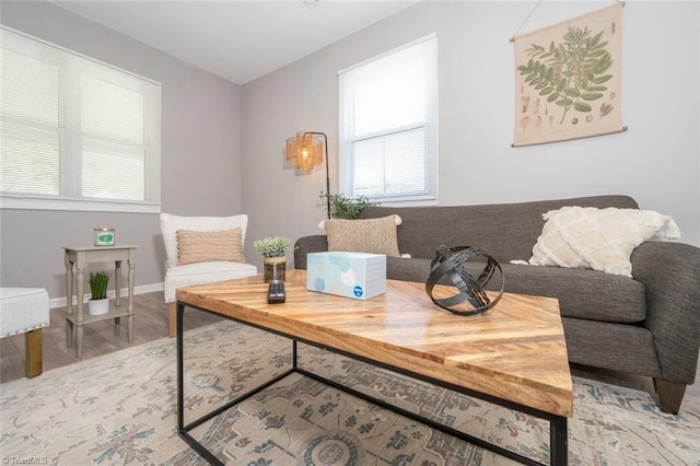 sitting room with wood finished floors and baseboards