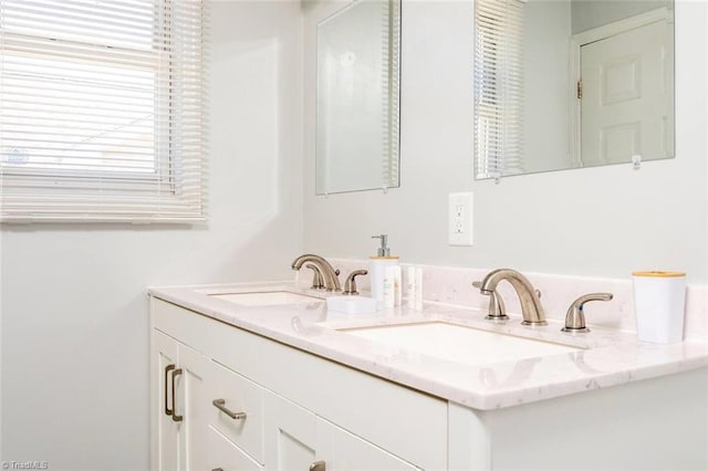 bathroom with double vanity