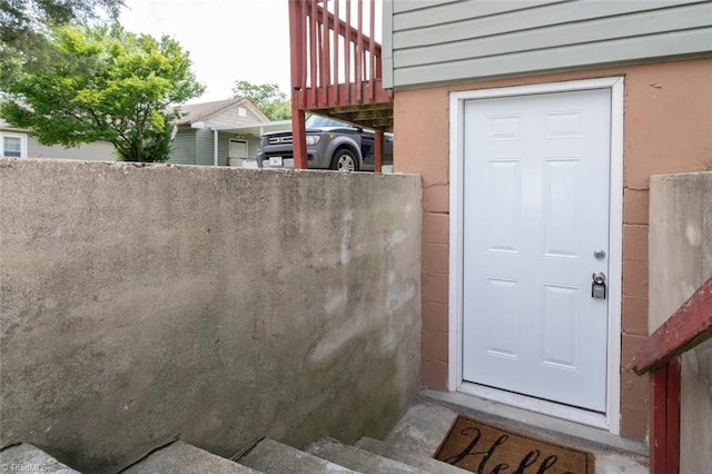 doorway to property with fence