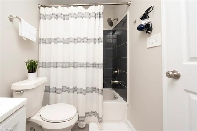 bathroom featuring toilet, shower / tub combo with curtain, and vanity