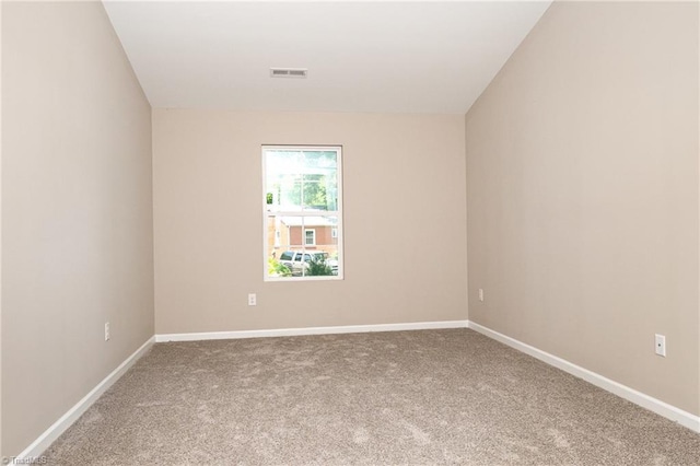 512 Guilford Ave, High Point, NC 27262 - carpeted spare room featuring baseboards