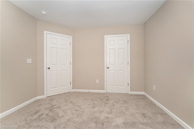 512 Guilford Ave, High Point, NC 27262 - unfurnished bedroom featuring carpet floors and baseboards