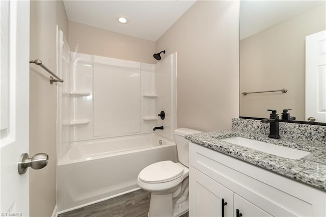512 Guilford Ave, High Point, NC 27262 - bathroom featuring toilet, vanity, wood finished floors, and bathing tub / shower combination