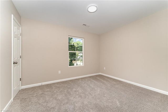 512 Guilford Ave, High Point, NC 27262 - carpeted spare room featuring baseboards