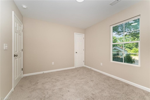 512 Guilford Ave, High Point, NC 27262 - carpeted spare room with baseboards and a smoke detector