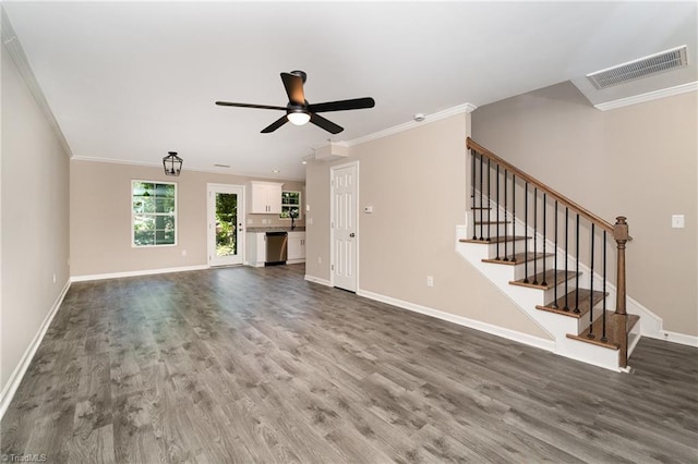 512 Guilford Ave, High Point, NC 27262 - unfurnished living room with dark wood finished floors, baseboards, ceiling fan, crown molding, and stairs